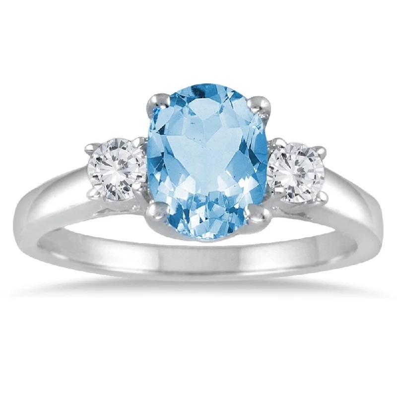 Geometric gemstone rings with sharp stone designs -1 3/4 Carat Blue Topaz and Diamond Three Stone Ring 14K White Gold