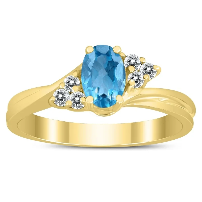 Gemstone rings inspired by oceans with blue gems -6X4MM Blue Topaz and Diamond Twist Ring in 10K Yellow Gold