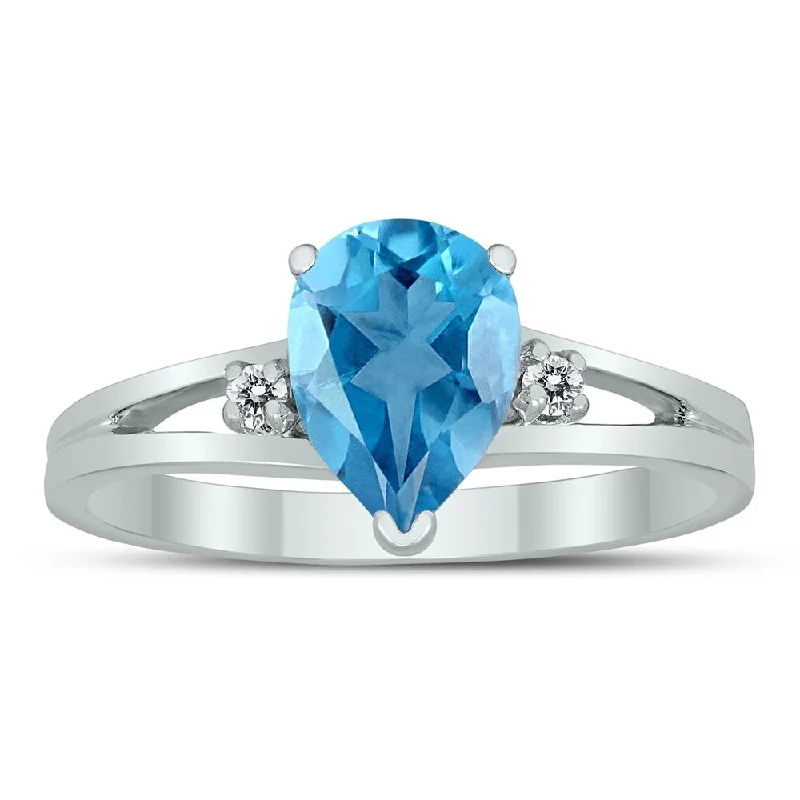 Gemstone rings featuring floral stones for romance -8X6MM Blue Topaz and Diamond Pear Shaped Open Three Stone Ring in 10K White Gold