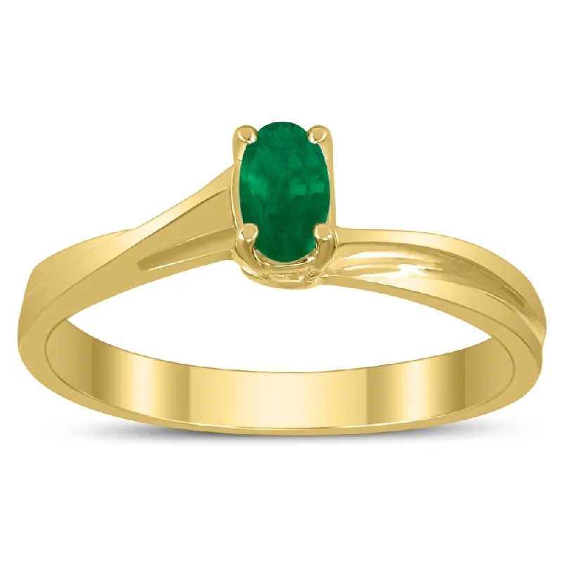 Gemstone rings perfect for stacking with others -Solitaire Oval 5X3MM Emerald Gemstone Twist Ring in 10K Yellow Gold