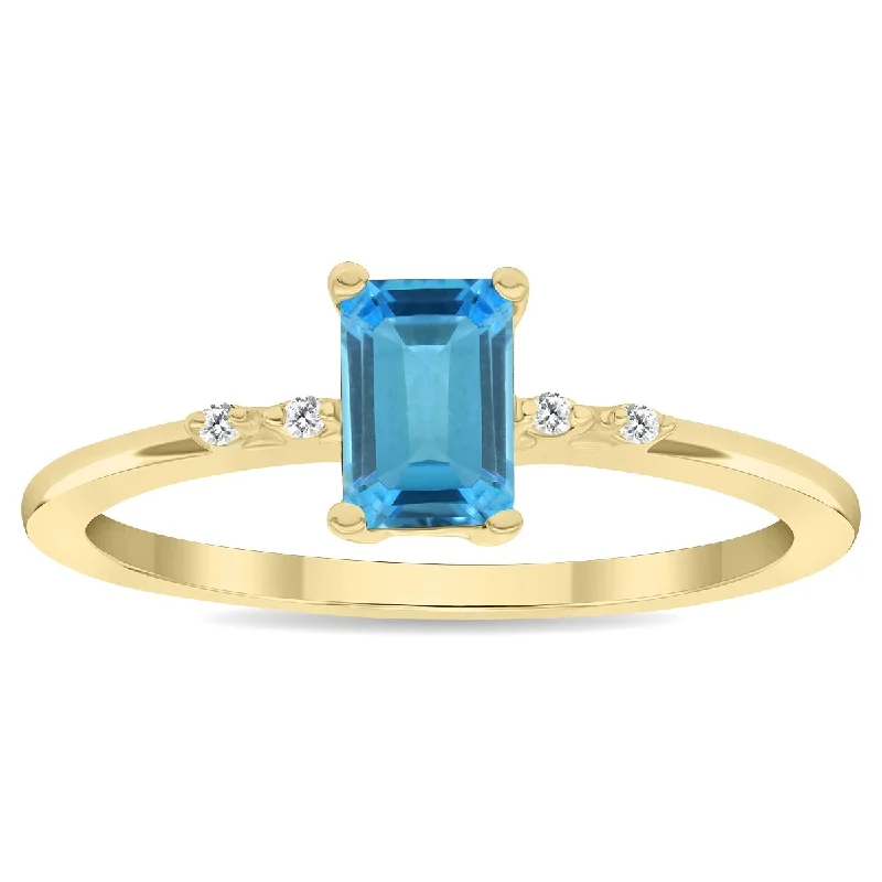 Gemstone rings with emerald for rich green allure -Women's Emerald Cut Blue Topaz and Diamond Sparkle Ring in 10K Yellow Gold