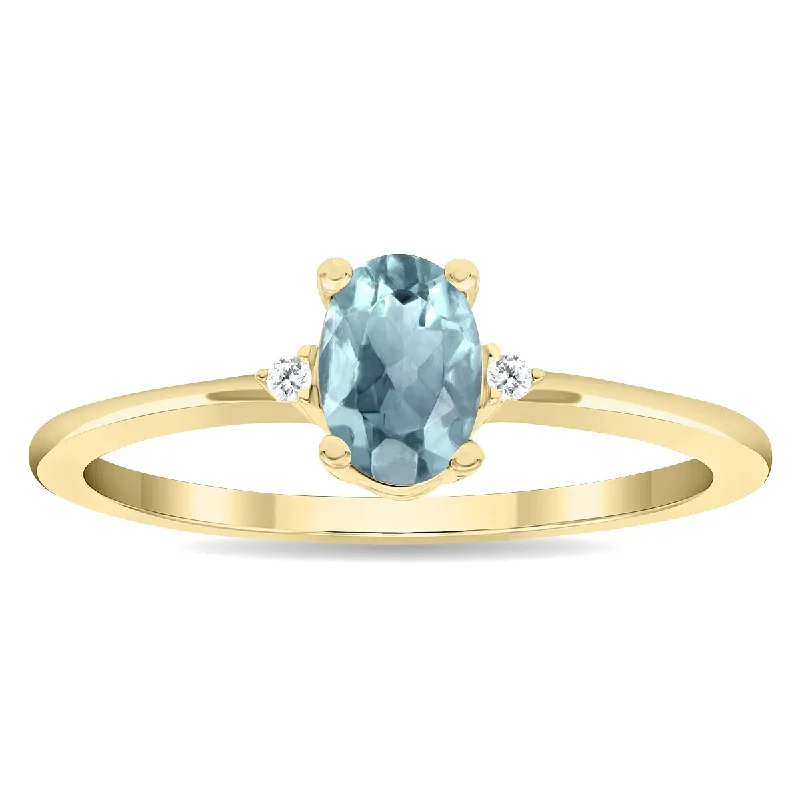 Gemstone rings featuring jade for green tranquility -Women's Oval Shaped Aquamarine and Diamond Classic Band in 10K Yellow Gold