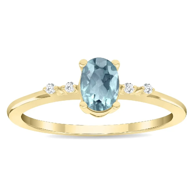 Gemstone rings featuring raw diamonds for wild beauty -Women's Oval Shaped Aquamarine and Diamond Sparkle Ring in 10K Yellow Gold