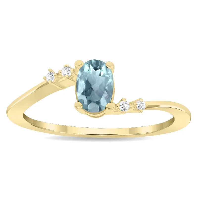 Gemstone rings featuring vivid stones for fierce style -Women's Oval Shaped Aquamarine and Diamond Tierra Ring in 10K Yellow Gold