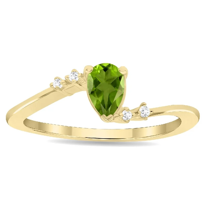 Chunky gemstone rings for big finger statements -Women's Pear Shaped Peridot and Diamond Wave Ring in 10K Yellow Gold