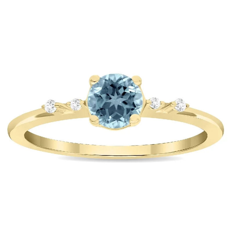 Fringe gemstone rings with stone drops for play -Women's Round Shaped Aquamarine and Diamond Sparkle Ring in 10K Yellow Gold