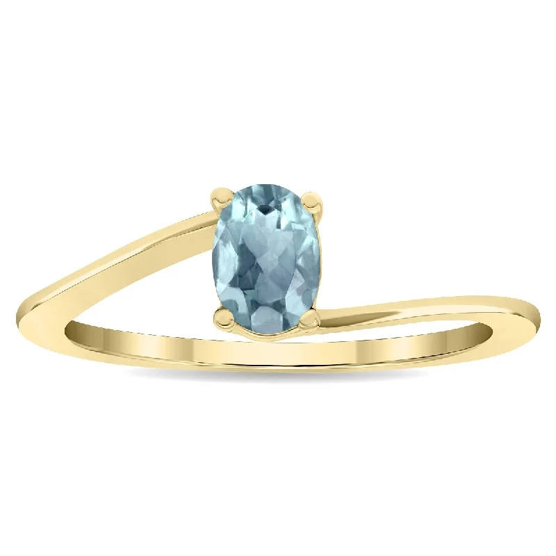 Gemstone rings inspired by vintage stone glamour -Women's Solitaire Oval Shaped Aquamarine Wave Ring in 10K Yellow Gold