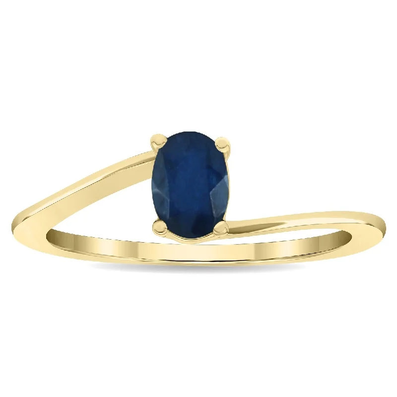 Gemstone rings featuring smoky quartz for earthy tones -Women's Solitaire Oval Shaped Sapphire Wave Ring in 10K Yellow Gold