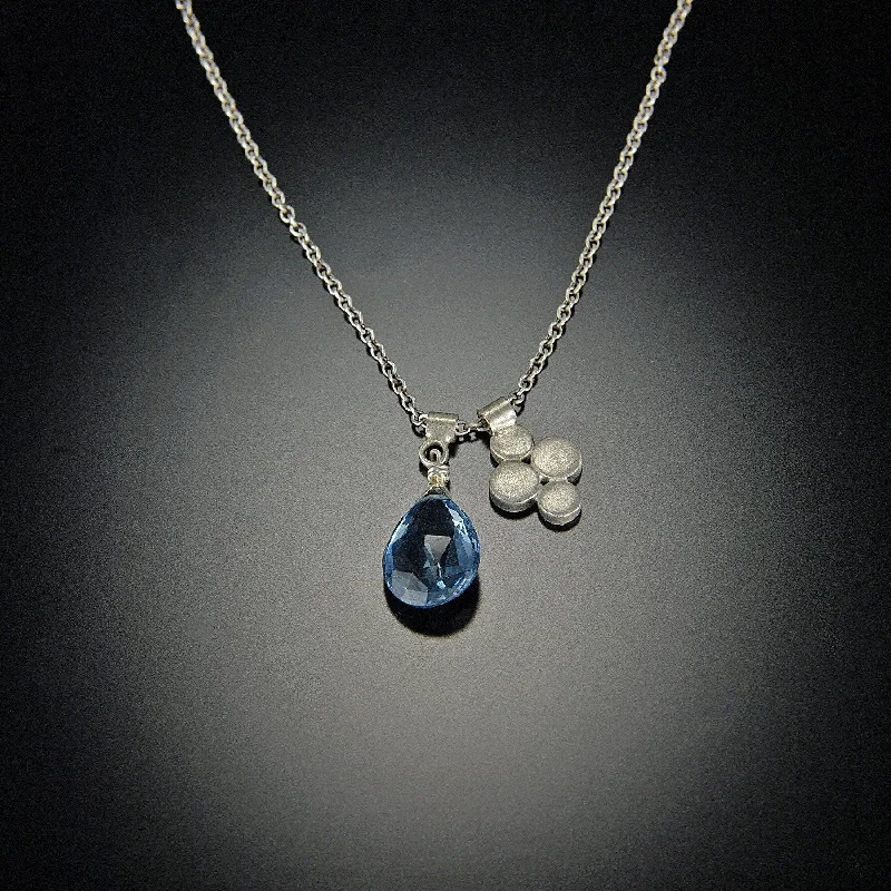 Crystal healing pendant necklaces for women interested in wellness and natural stones -London Blue Topaz and Small Disk Charm Necklace